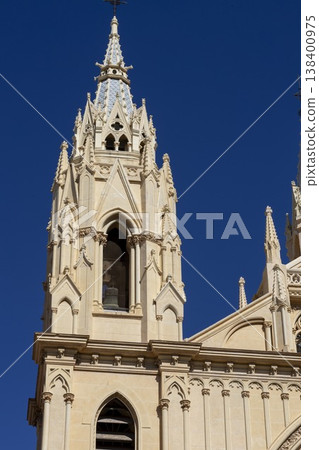 Majestic cathedral towers touch the vibrant blue skies of Malaga, Spain, showcasing exquisite architectural beauty and cultural heritage Majestic cathedral towers touch the vibrant blue skies of Malaga, Spain, showcasing exquisite architectural beauty and cultural heritage 138400975