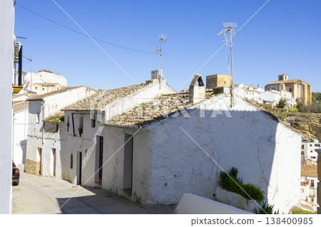 Scenic view of Setenil de las Bodegas in Spain showing traditional white houses and blue sky Scenic view of Setenil de las Bodegas in Spain showing traditional white houses and blue sky 138400985