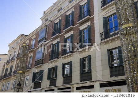Building with balconies and lights in Malaga, Spain on a clear day in the afternoon 138401019