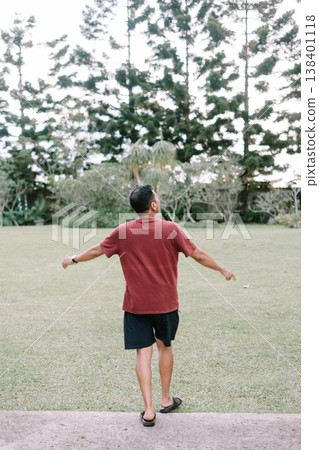 Freedom expression with hands up in nature landscape 138401118