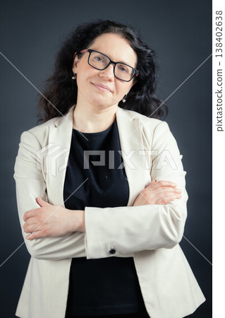 Smiling professional woman showing confidence and expertise Smiling professional woman showing confidence and expertise 138402638