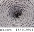 Textured cotton tape  background, rows of yarn for knitting forming geometric patterns and curves. 138402694