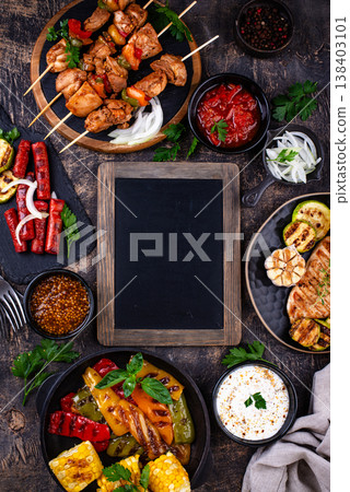 Assortment of grilled bbq meat and vegetables 138403101