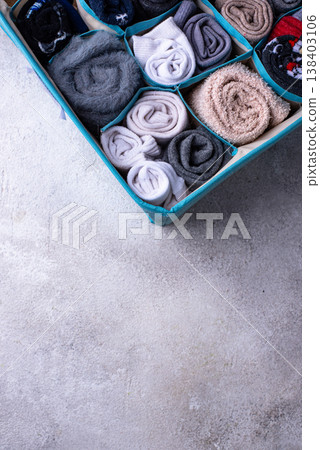 Decluttering concept. Organizing sock storage Decluttering concept. Organizing sock storage 138403106