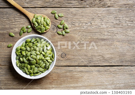 pumpkin seeds in bowl pumpkin seeds in bowl 138403193