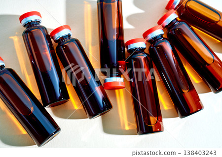 Glass ampules containing liquid medicine on white background Glass ampules containing liquid medicine on white background 138403243