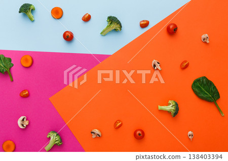Diet, detox and healthy food concept - top view flat lay of fresh organic raw vegetables on abstract bright background. Ingredients for salad - broccoli, mushroom, carrot, cherry tomato, spinach 138403394