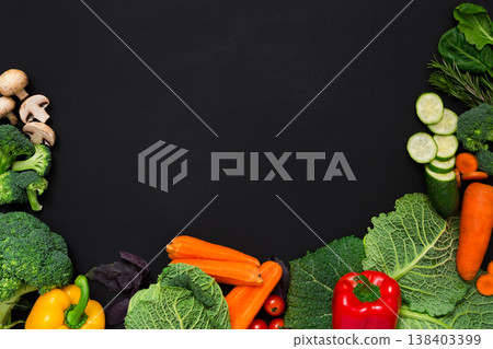 Fresh vegetables border on black background. Vegetarian cooking. Healthy natural food with copy space. Fresh vegetables border on black background. Vegetarian cooking. Healthy natural food with copy space. 138403399