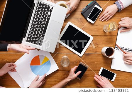 Business people meeting crop background top view with copy space on tablet. Wooden workspace 138403521