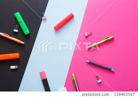 Stationery supplies and devices - top view, flat lay, mockup of creative work space at modern office with markers, rubbers, pens, scissors and binder clips, nobody, objects, copy space 138403567