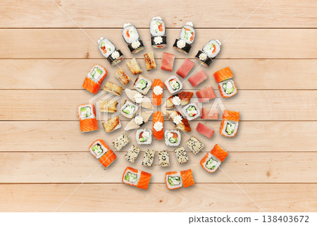 Japanese food restaurant, sushi california gunkan roll plate or platter set. Sushi at wooden planks background. Top view, flat lay. Big party sushi set. Japanese food restaurant, sushi california gunkan roll plate or platter set. Sushi at wooden planks background. Top view, flat lay. Big party sushi set. 138403672