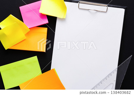 School stationery. Top view on colorful sticky blank notes, ruller and empty note paper on black background. Mockup for check-list with copy space School stationery. Top view on colorful sticky blank notes, ruller and empty note paper on black background. Mockup for check-list with copy space 138403682