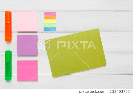 Flat lay of office stationery supplies - colorful markers, sticky notes and memo blocks, notepad on white rustic wood background, top view with copy space, nobody, objects Flat lay of office stationery supplies - colorful markers, sticky notes and memo blocks, notepad on white rustic wood background, top view with copy space, nobody, objects 138403793