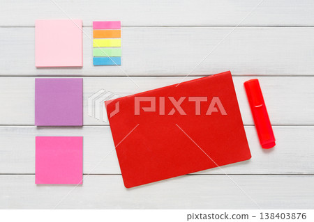 Flat lay of bright office stationery supplies - colorful markers, sticky notes and memo blocks, notepad on white rustic wood background, top view with copy space, nobody, objects Flat lay of bright office stationery supplies - colorful markers, sticky notes and memo blocks, notepad on white rustic wood background, top view with copy space, nobody, objects 138403876