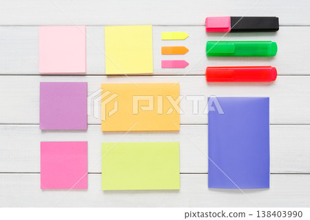 Flat lay of office and business stationery supplies - colorful markers, sticky notes and memo blocks, notepad, pen on white rustic wooden board background, top view with copy space, nobody, objects Flat lay of office and business stationery supplies - colorful markers, sticky notes and memo blocks, notepad, pen on white rustic wooden board background, top view with copy space, nobody, objects 138403990