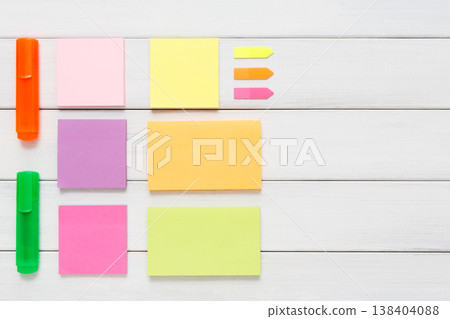 Flat lay of office stationery supplies - colorful markers, sticky notes and memo blocks, notepad on white rustic wood background, top view with copy space, nobody, objects Flat lay of office stationery supplies - colorful markers, sticky notes and memo blocks, notepad on white rustic wood background, top view with copy space, nobody, objects 138404088