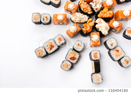 Sushi platter isolated on white background. Japanese food restaurant delivery - maki california rolls big party set, top view Sushi platter isolated on white background. Japanese food restaurant delivery - maki california rolls big party set, top view 138404180