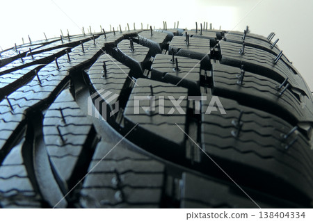 Part of new vehicle tire close up stock photo. Close up of a New Tire Tread Part of new vehicle tire close up stock photo. Close up of a New Tire Tread 138404334
