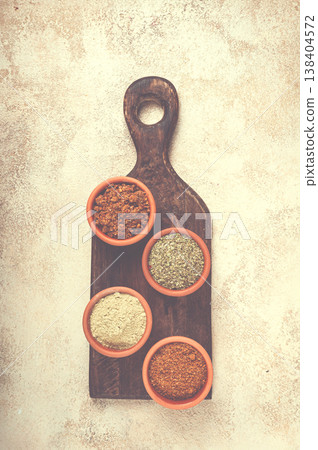 Georgian spices, in ceramic bowls, assortment, set of spices, utsho, adjika, Svan salt, ground coriander, top view, no people, Georgian spices, in ceramic bowls, assortment, set of spices, utsho, adjika, Svan salt, ground coriander, top view, no people, 138404572