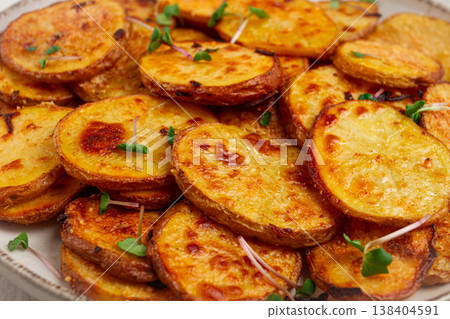Crispy potato slices, with parmesan cheese and spices, fried in the oven, homemade, no people, 138404591