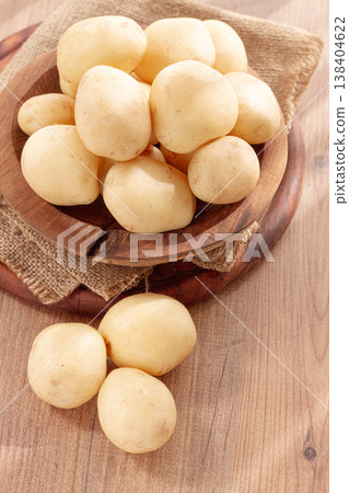 boiled new potatoes, in a wooden bowl, on a rustic table, natural light, no people, boiled new potatoes, in a wooden bowl, on a rustic table, natural light, no people, 138404622