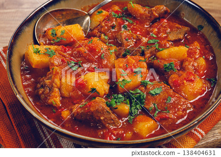 Potatoes with meat, stewed in tomato sauce, with spices and herbs, homemade, no people, 138404631