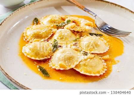Italian dish, ravioli with butter and sage top view, no people, Italian dish, ravioli with butter and sage top view, no people, 138404640