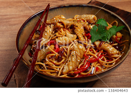 udon noodles, with squid and vegetables, on a wooden table, homemade, no people, udon noodles, with squid and vegetables, on a wooden table, homemade, no people, 138404643