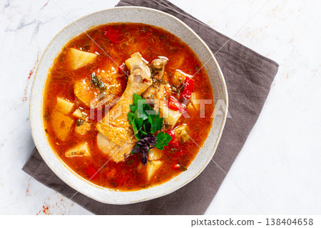 Souzi soup. Georgian dish, meat with oats, tomato sauce and herbs, 138404658