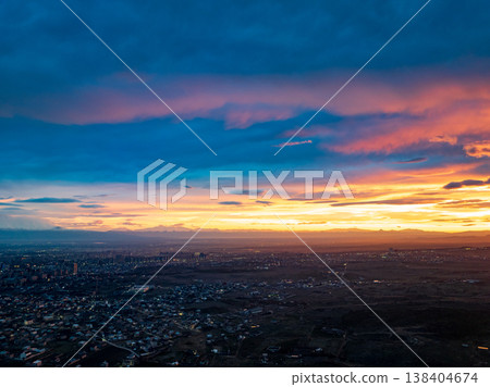 Aerial view of sprawling metropolis during sunset Aerial view of sprawling metropolis during sunset 138404674