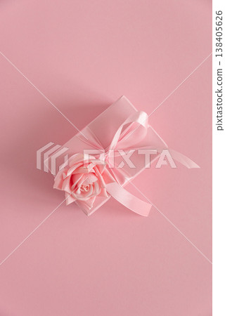 Pink Gift Box with Rose. Romantic Valentines or Mothers Day Flatlay on Soft Pink Background Pink Gift Box with Rose. Romantic Valentines or Mothers Day Flatlay on Soft Pink Background 138405626