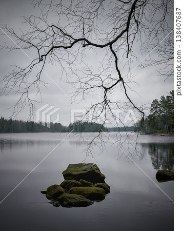 Tranquil Landscape Captured With Gentle Ripples And Muted Tones 138407687