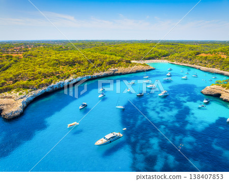 Aerial view of Cala Mondrago bay and turquoise sea in Mallorca, Spain. Aerial view of Cala Mondrago bay and turquoise sea in Mallorca, Spain. 138407853