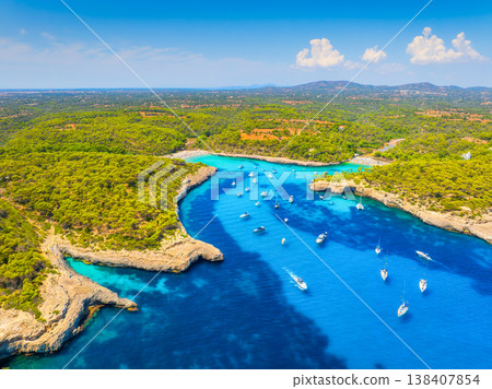 Aerial view of Cala Mondrago bay and turquoise sea in Mallorca, Spain. Aerial view of Cala Mondrago bay and turquoise sea in Mallorca, Spain. 138407854