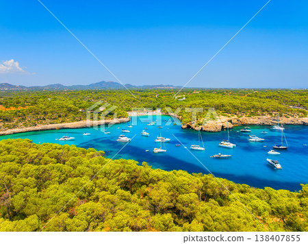 Aerial view of Cala Mondrago bay and turquoise sea in Mallorca, Spain. Aerial view of Cala Mondrago bay and turquoise sea in Mallorca, Spain. 138407855