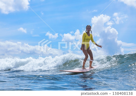 Young Lady With Composed Stance Amidst Peaceful Sea And Clear Sky Backdrop Young Lady With Composed Stance Amidst Peaceful Sea And Clear Sky Backdrop 138408138
