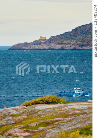 pleasure boats in the sea, the coast of the Barents Sea, Russia, the rocky shore with colourful arctic carpet of moss, yagel, Tundra at autumn, Murmansk region 138408274