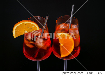 Two Aperol spritz cocktails with orange slice and ice. Two Aperol spritz cocktails with orange slice and ice. 138408372
