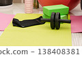 Green yoga blocks and white strap on green background. Yoga practice, relaxation and meditation concept. Top view with copy space. High quality photo 138408381