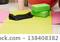 Green yoga blocks and white strap on green background. Yoga practice, relaxation and meditation concept. Top view with copy space. High quality photo 138408382