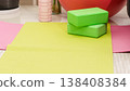 Green yoga blocks and white strap on green background. Yoga practice, relaxation and meditation concept. Top view with copy space. High quality photo 138408384