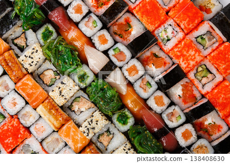Sushi and rolls pattern background, japanese restaurant delivery top view. Salmon, unagi, california and other healthy meals 138408630