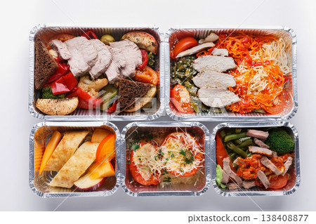 Healthy food in lunch boxes background. Eating right concept. Fresh diet daily meals delivery. Vegetables, meat and fruits on wood Healthy food in lunch boxes background. Eating right concept. Fresh diet daily meals delivery. Vegetables, meat and fruits on wood 138408877