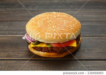 Classic american burger fast food. Big double burger at wood. Hamburger with fresh vegetables and meat. Burger with cheese, beef, tomato, lettuce. Cheeseburger at rustic wooden background. Classic american burger fast food. Big double burger at wood. Hamburger with fresh vegetables and meat. Burger with cheese, beef, tomato, lettuce. Cheeseburger at rustic wooden background. 138408903