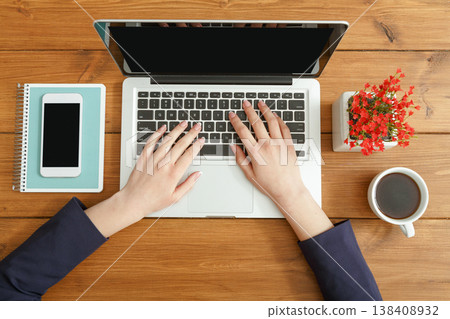 Woman hands using laptop. Freelancer working with portable computer in coffee shop, top view, close up 138408932