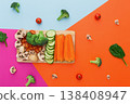 Vegetables on colorful abstract background. Healthy eating and diet. Cut raw vegetables on wooden board, copy space. Ingredients for salad or soup - mushroom, cherry tomato, broccoli, cucumber, carrot 138408947