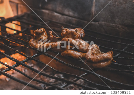Cow bowels presented on a grill. Argentine Traditional cuisine. Cow bowels presented on a grill. Argentine Traditional cuisine. 138409531