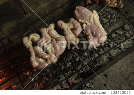 Cow bowels presented on a grill. Argentine Traditional cuisine. Cow bowels presented on a grill. Argentine Traditional cuisine. 138410055