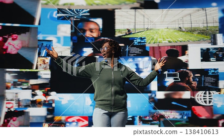 Happy woman delighted by access to video recommendations delivered instantly. Jolly user excited by digital era enabling unlimited streaming opportunities, looking at clips on interface, camera A 138410613