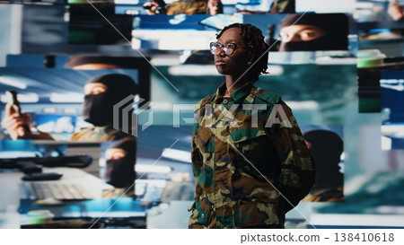 Soldier in control center providing real time combat support, looking at reconnaissance feeds. Intelligence agency expert looking at battlefield communication network videowall, camera A Soldier in control center providing real time combat support, looking at reconnaissance feeds. Intelligence agency expert looking at battlefield communication network videowall, camera A 138410618